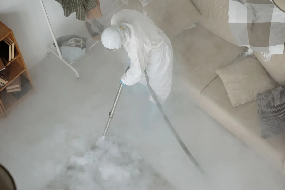 Biohazard cleanup technician in protective equipment, Ford City, PA